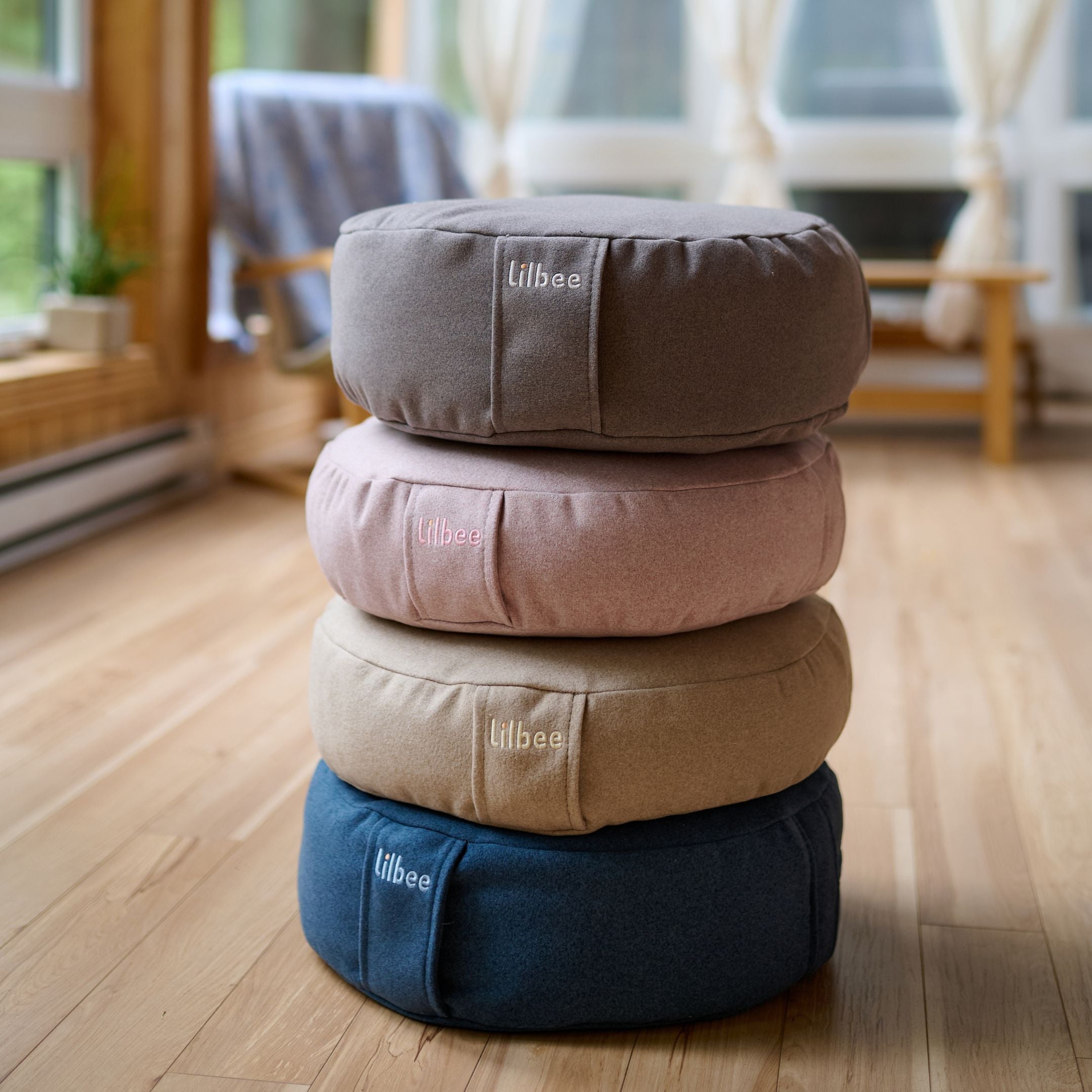 a collection of Lilbee's Zafu meditation cushions in four sober colors